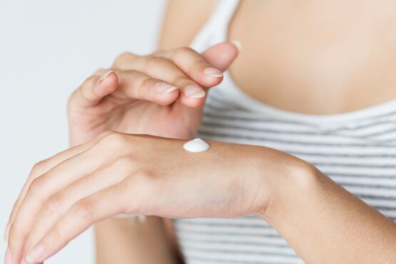 Photo of hands rubbing in hand lotion